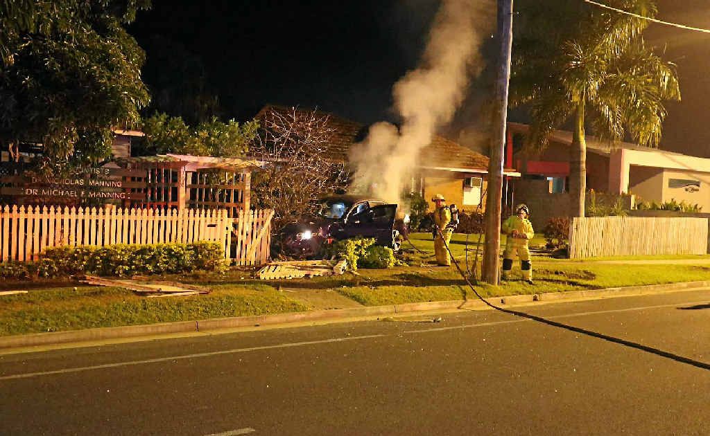A car lets off a bit of steam after ploughing into a residence’s garden in Fitzroy Street at midnight on Wednesday. The car brought down a large piece of the resident's fence. A car lets off a bit of steam after ploughing into a residence’s garden in Fitzroy Street at midnight on Wednesday. The car brought down a large piece of the resident's fence.